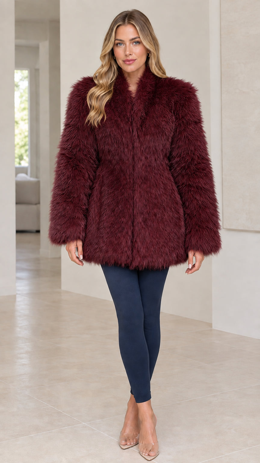 Front view of model wearing a Burgundy shaggy faux fur coat