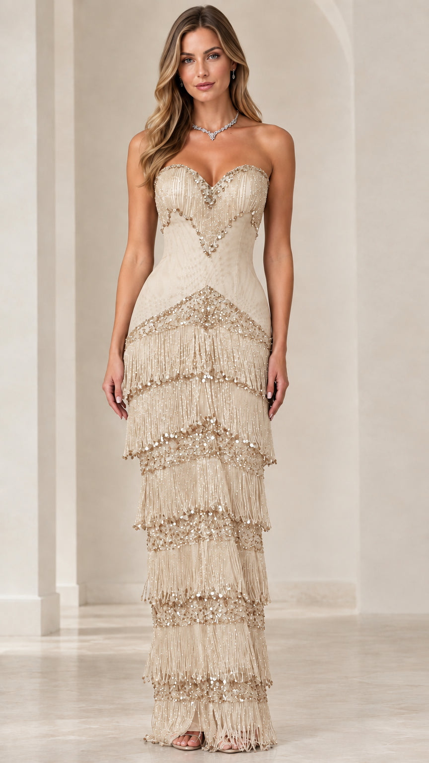 Front view of champagne gold tiered beaded fringe evening gown