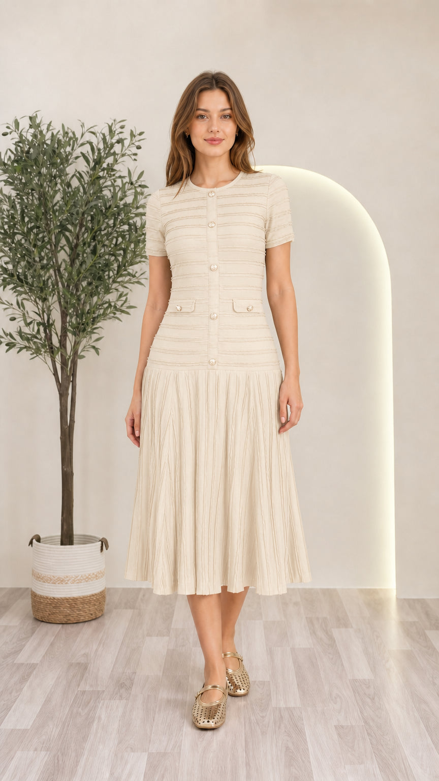 Model wearing cream off-white short sleeve pleated knit midi dress