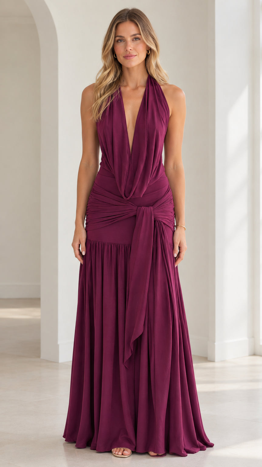 Burgundy plunging halter neck maxi dress with ruched waist and side drape front view