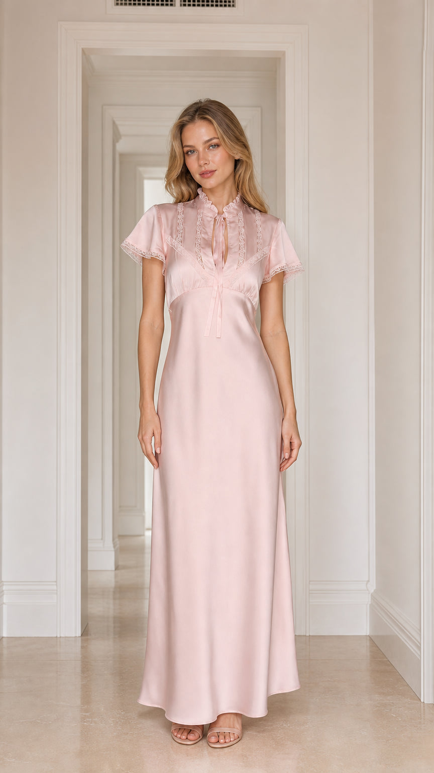 Model wearing pink satin lace-trim maxi dress, front view