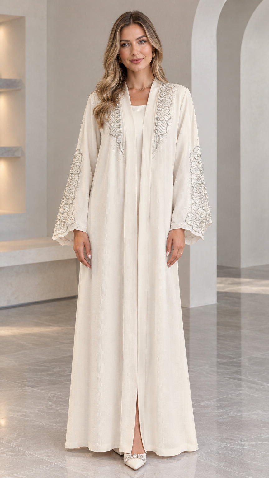 Front full view of Cream embroidered long abaya dress on model