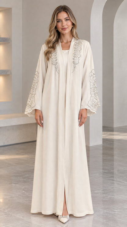 Front full view of Cream embroidered long abaya dress on model