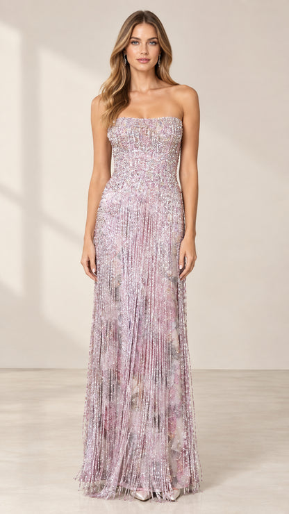 Front full-length view of model wearing lilac strapless beaded fringe evening gown