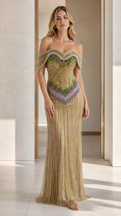 Front view of model wearing gold off-shoulder beaded evening gown