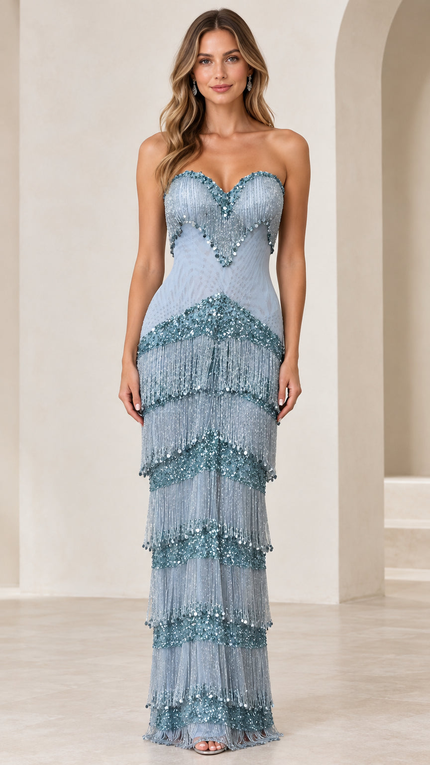Front view of woman wearing dusty blue strapless beaded fringe maxi evening gown
