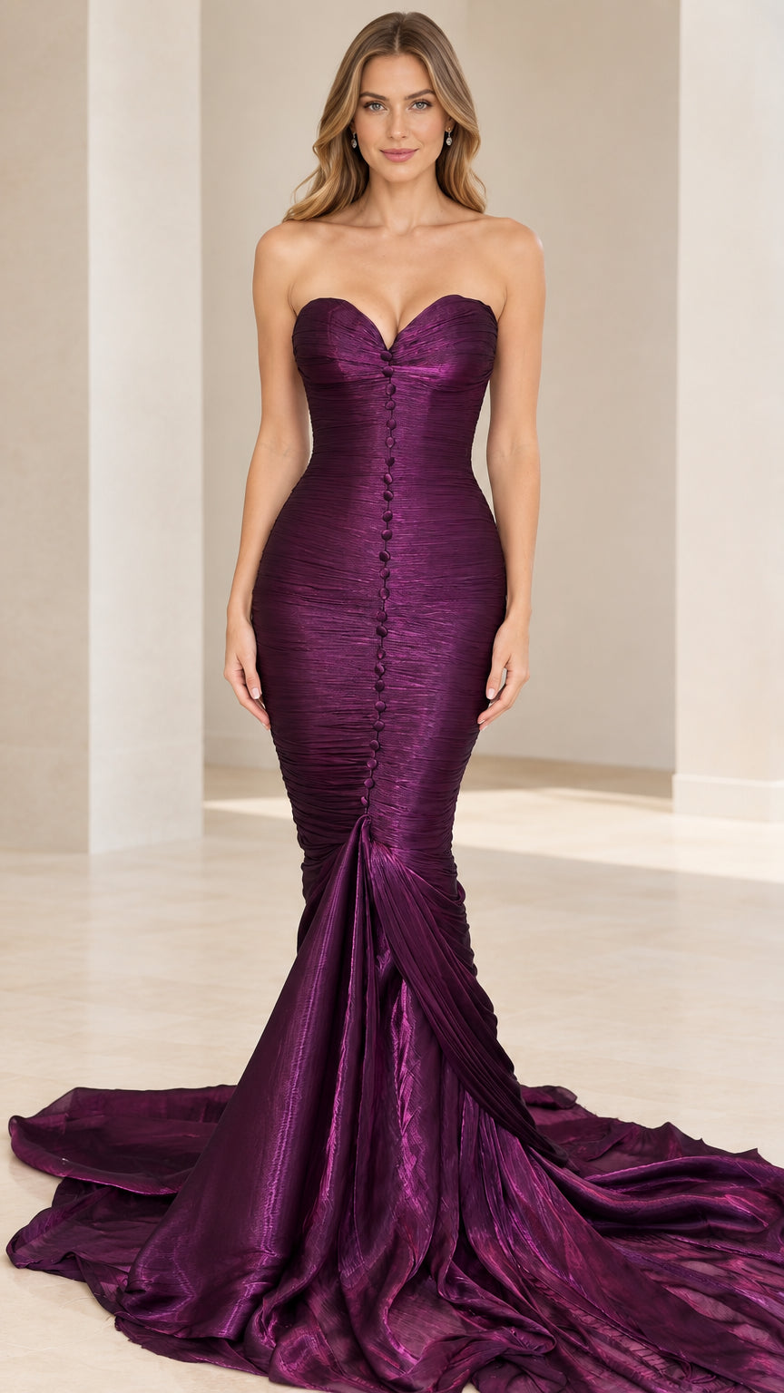 Front view of model wearing purple strapless ruched mermaid evening gown with sweeping train