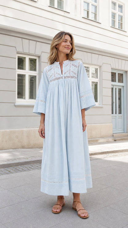 Woman wearing Light Blue embroidered lace-trim maxi dress standing in street