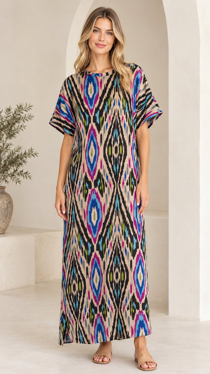 Front view of woman wearing Beige Multi ikat print short sleeve maxi dress