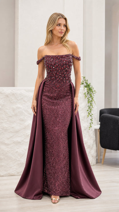 Front view of burgundy off-shoulder beaded evening gown with overskirt