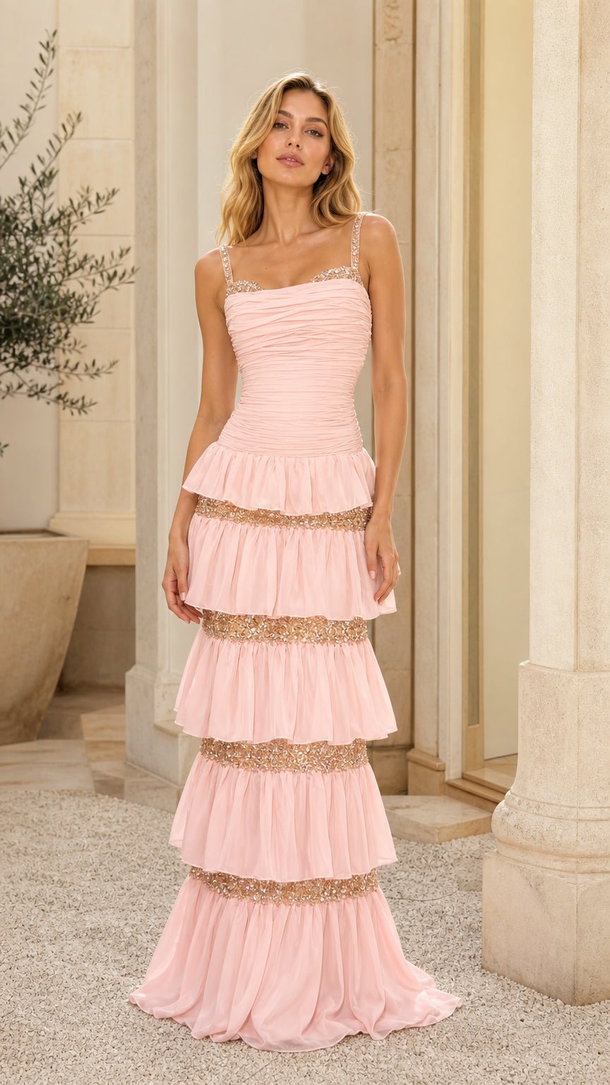 Front view of model wearing pink tiered sequin maxi dress