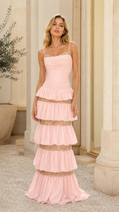 Front view of model wearing pink tiered sequin maxi dress