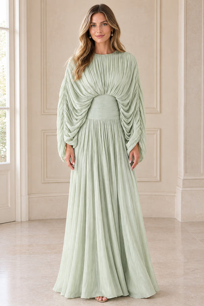 Front view of model wearing Sage Green pleated draped cape sleeve maxi dress