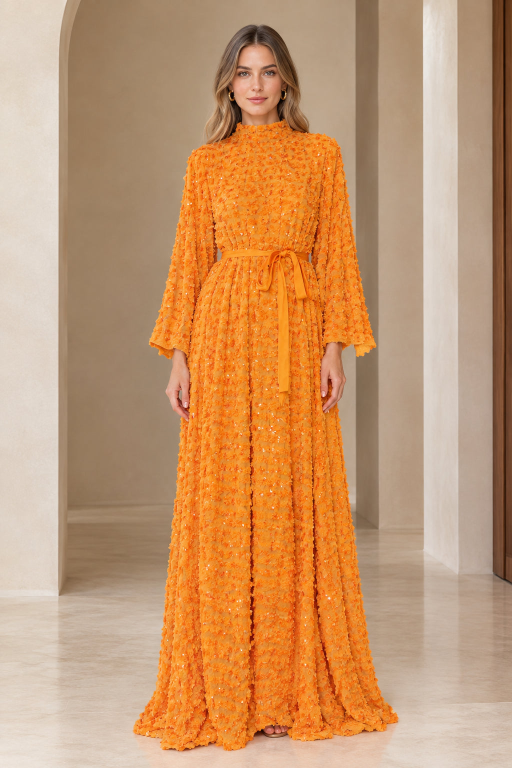 Front full view of textured sequin high neck bell sleeve maxi dress in orange