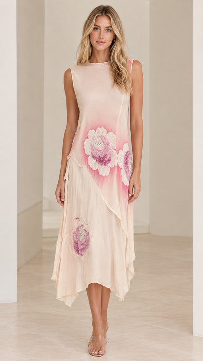 Front view of model wearing Blush Pink sleeveless asymmetrical floral midi dress