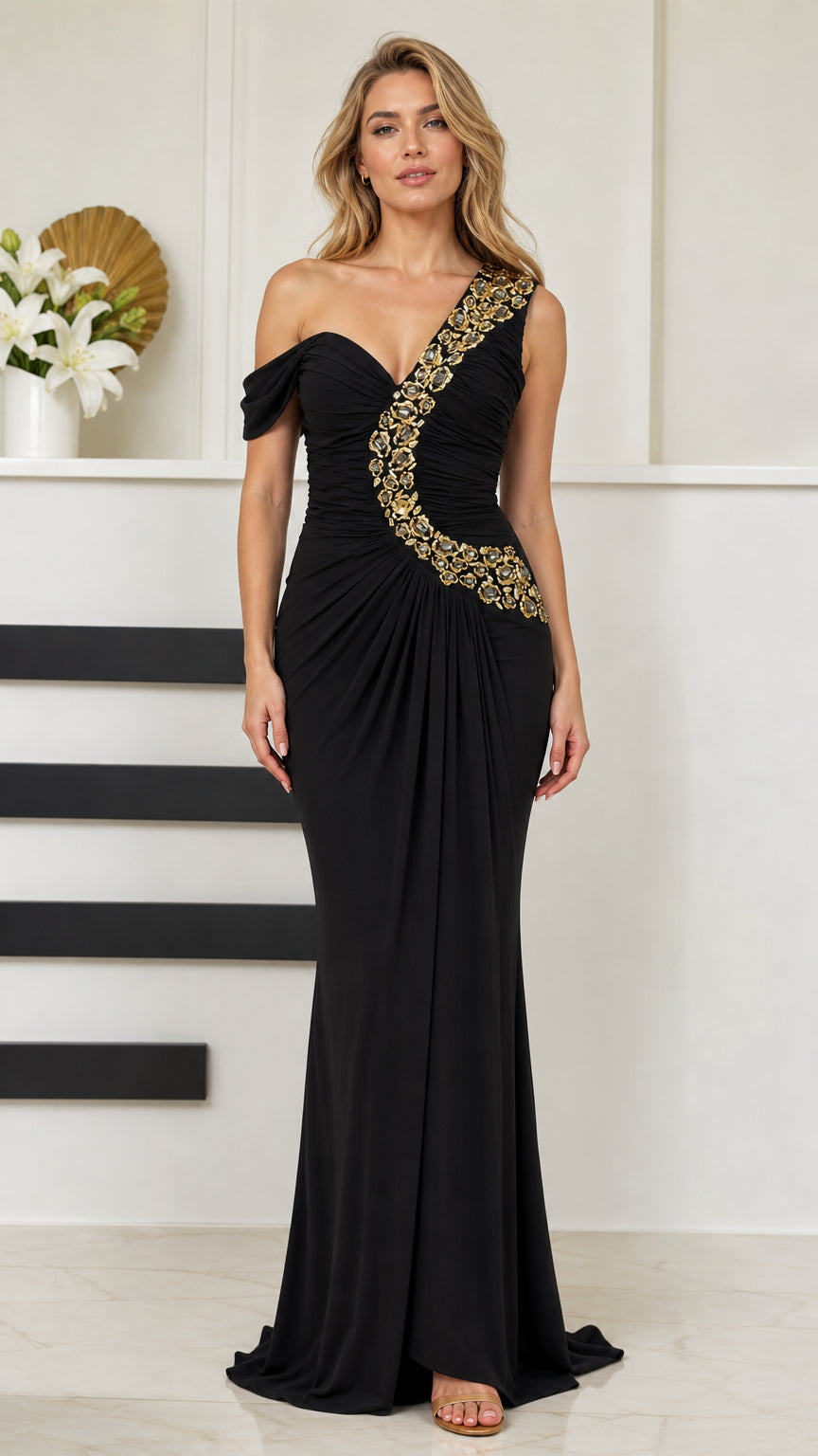 Front full view of woman wearing black one-shoulder beaded ruched evening gown