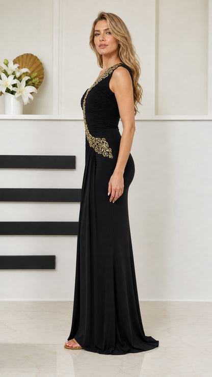 Side profile of woman in black one-shoulder crystal-embellished formal maxi dress