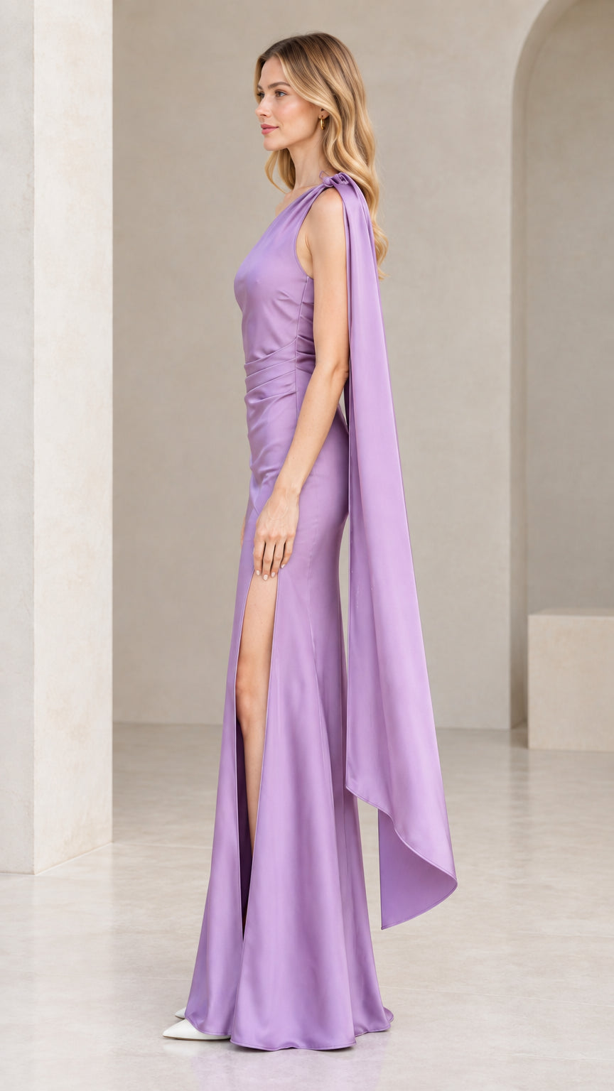 Side profile of lavender one-shoulder satin evening dress showing the high leg slit