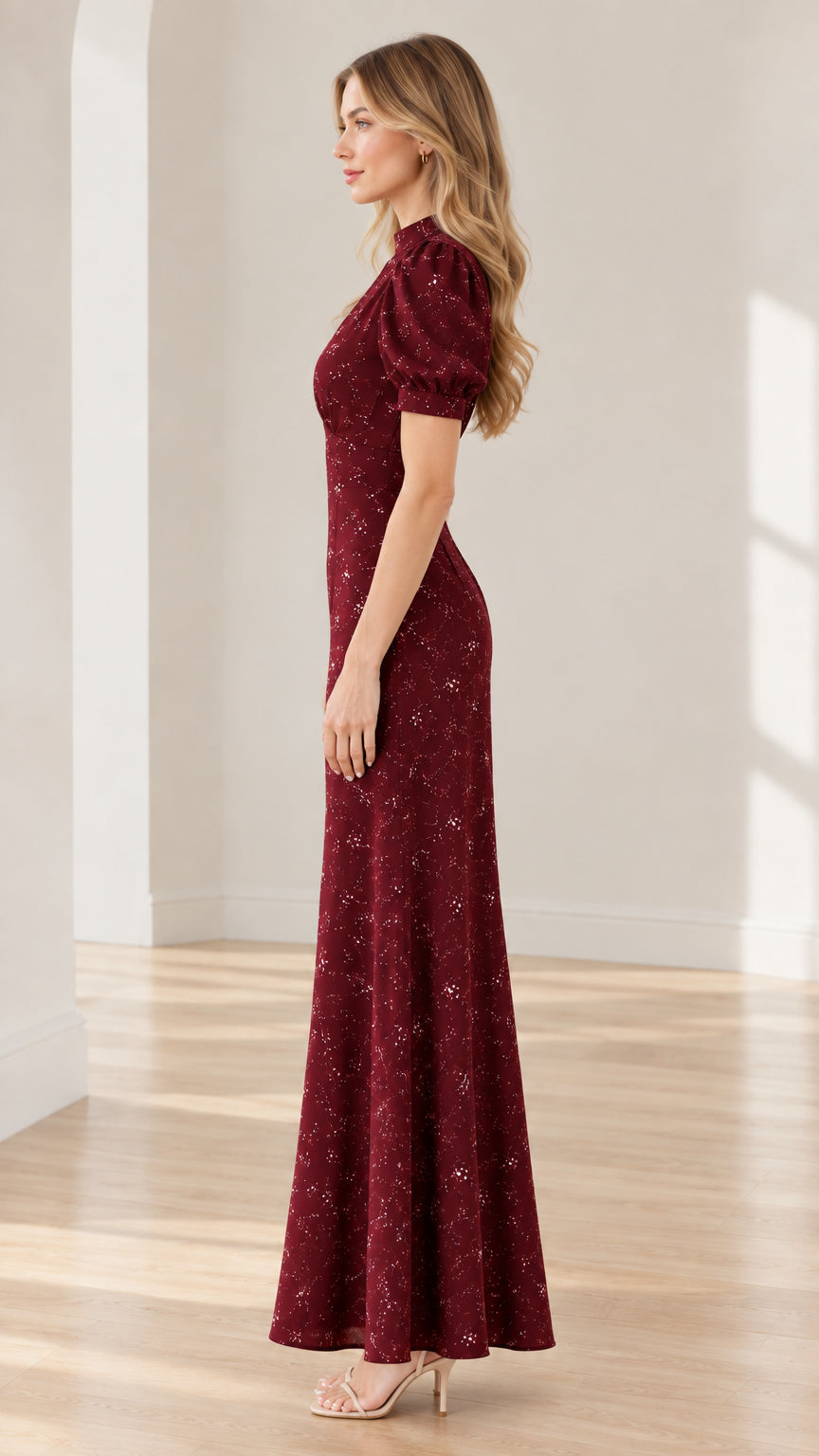Side profile view of burgundy floral short sleeve long formal dress