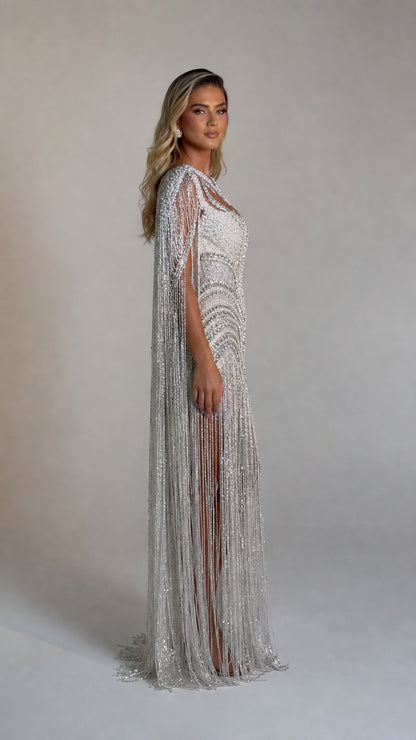 Side profile view of the silver beaded evening gown