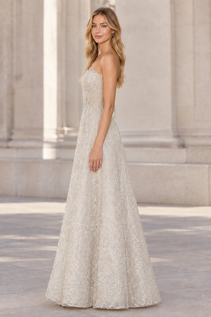 Side profile of silver strapless formal evening dress with shimmering embroidery