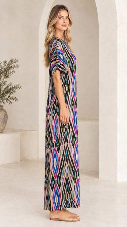 Side profile view of woman in Beige Multi printed maxi dress