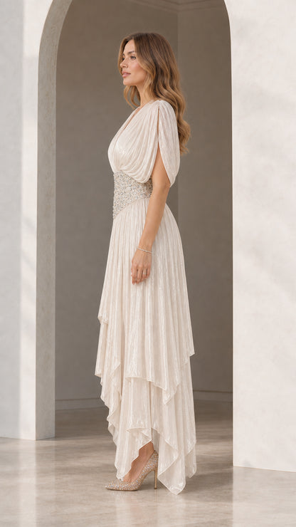 Side profile view of woman wearing Champagne pleated formal maxi gown