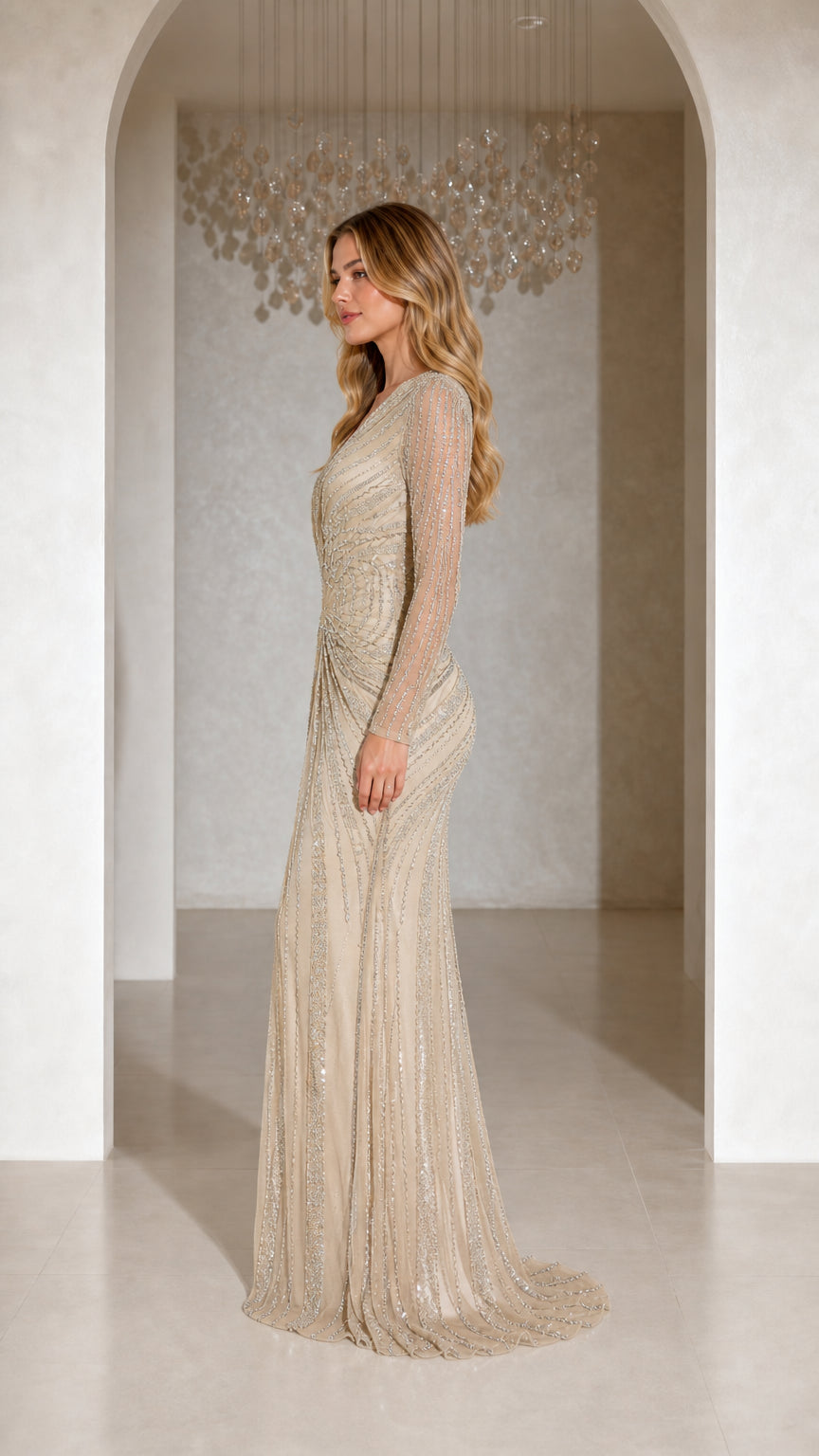 Side profile view of champagne beaded floor-length formal gown showing elegant silhouette