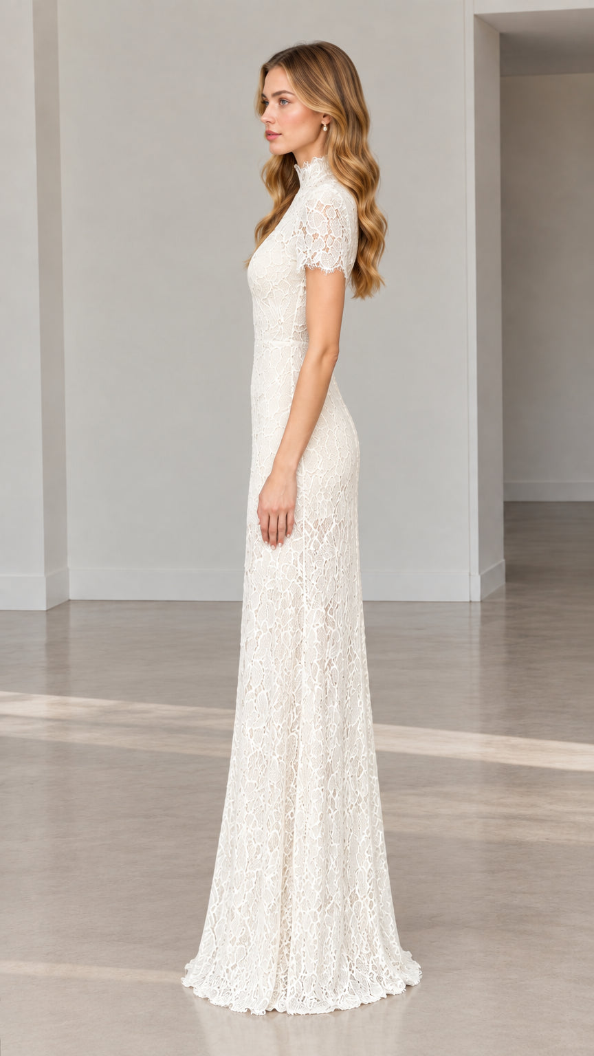 Side full-length view of model wearing ivory high-neck floral lace gown