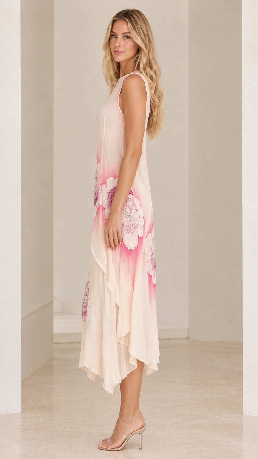 Side angle view of Blush Pink tiered handkerchief hem midi dress