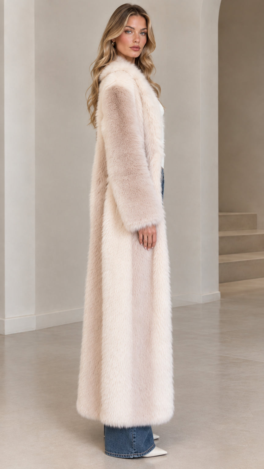 Side profile of model in full-length cream faux fur winter coat