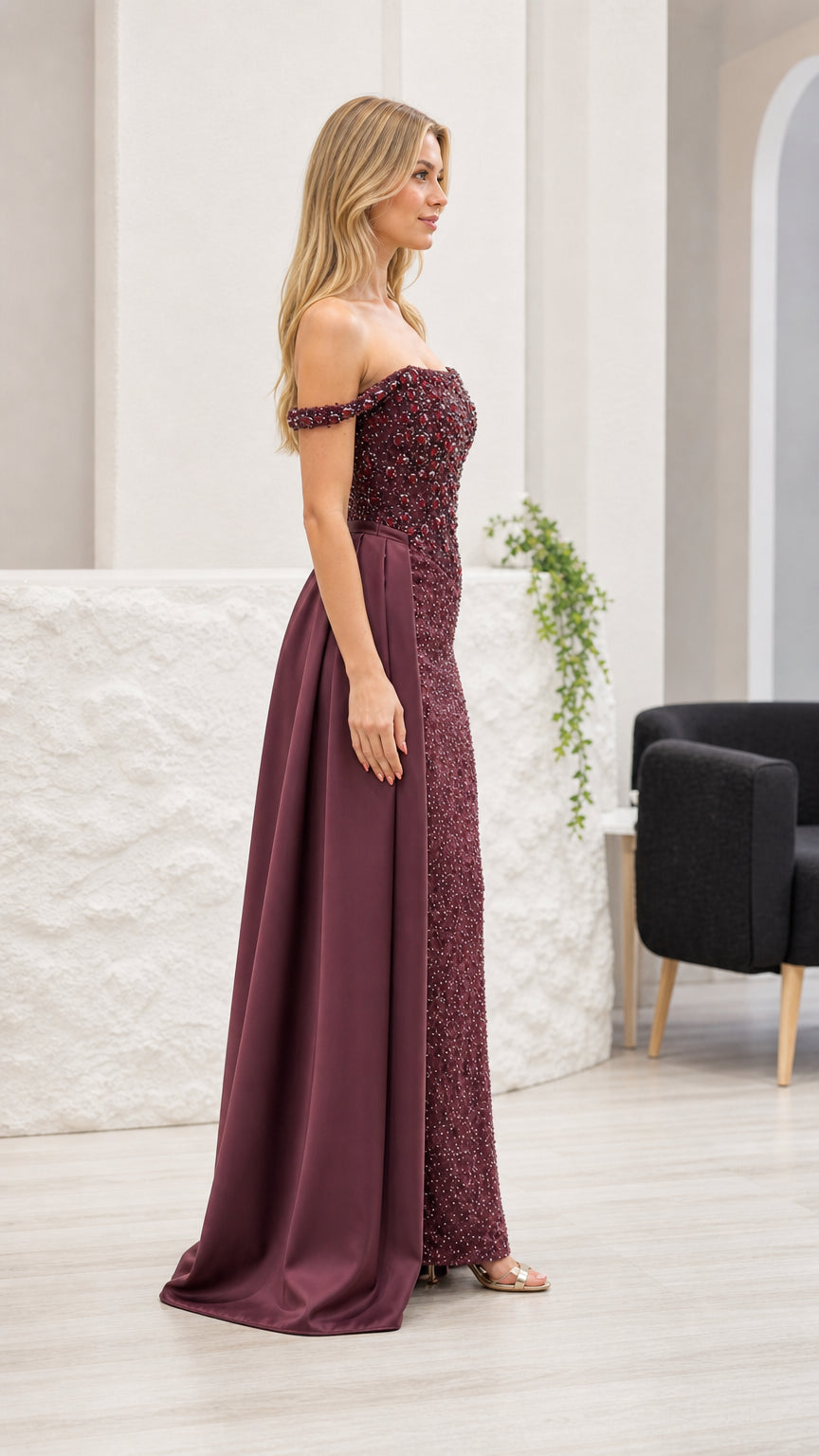 Side profile view of burgundy evening gown