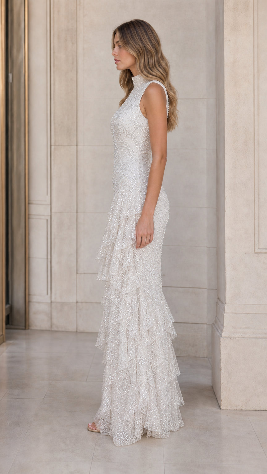 Side profile view of ivory sleeveless lace tiered formal maxi dress