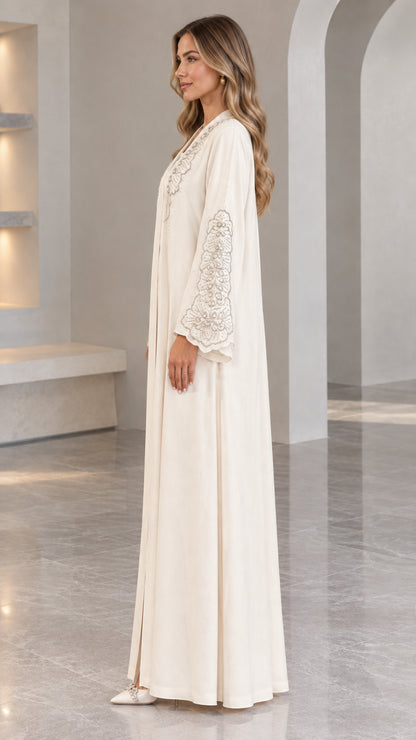 Side profile of Cream embroidered maxi dress with flared sleeves