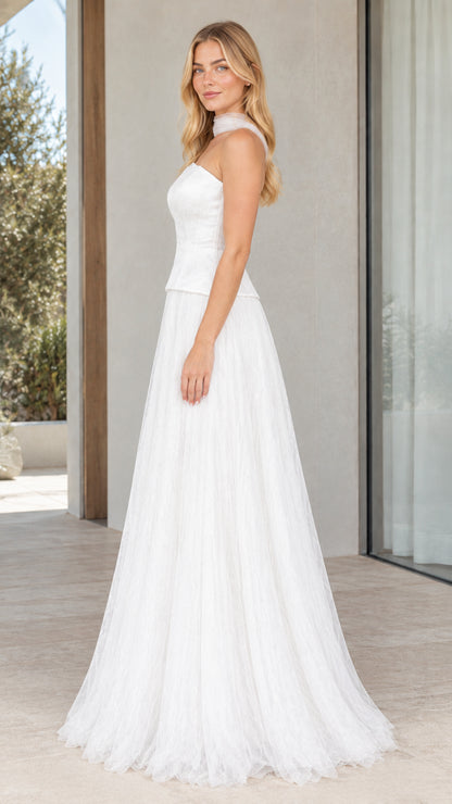Side profile of white strapless corset tulle formal dress