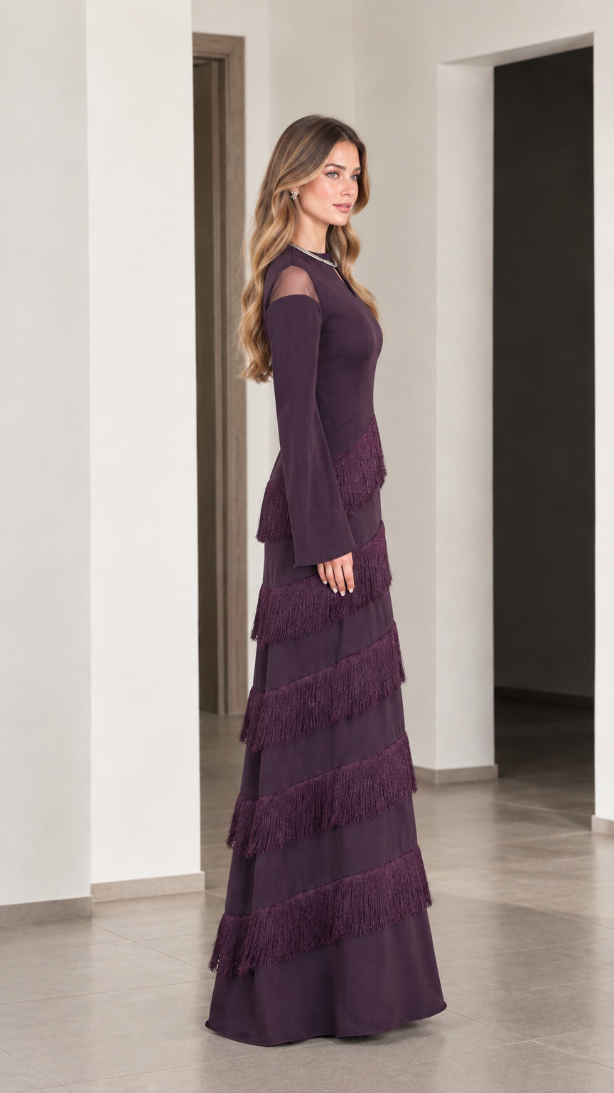 Side angle view of Plum long sleeve tiered fringe maxi dress