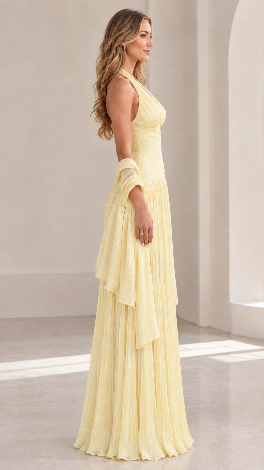 Side profile of Butter Yellow pleated halter formal gown with matching wrap