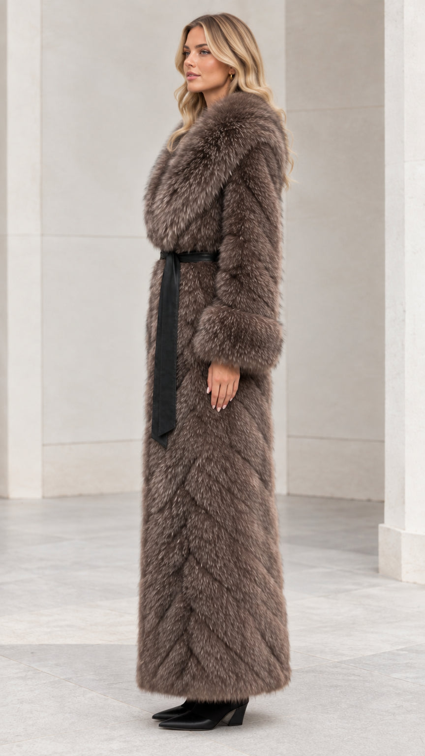 Side profile view of taupe brown long faux fur coat showing oversized collar and maxi length