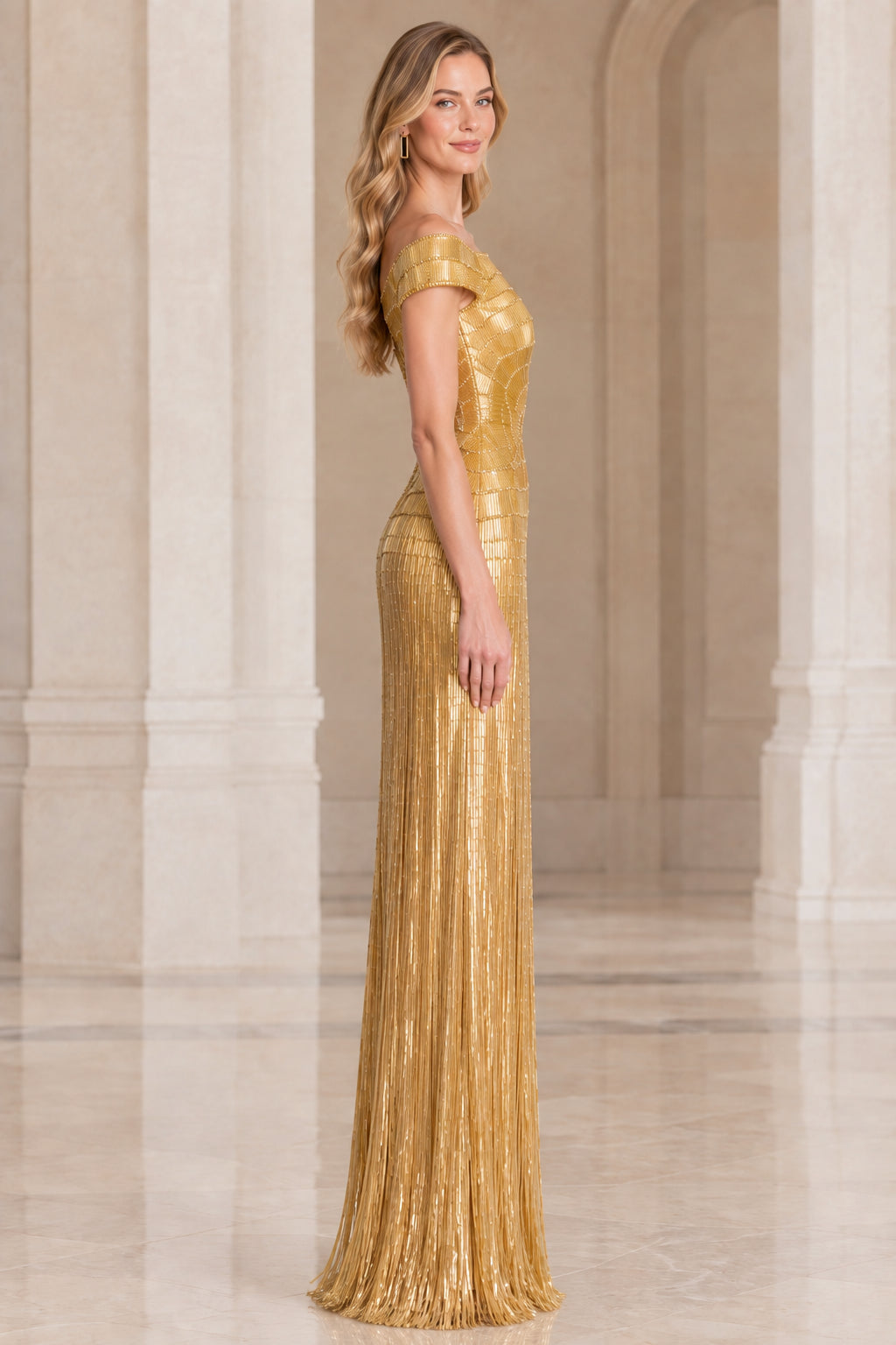 Side profile of woman in gold linear beaded floor-length formal gown