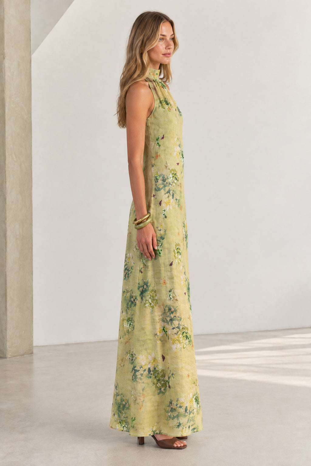 Side profile of model wearing Sage Green watercolor floral maxi dress