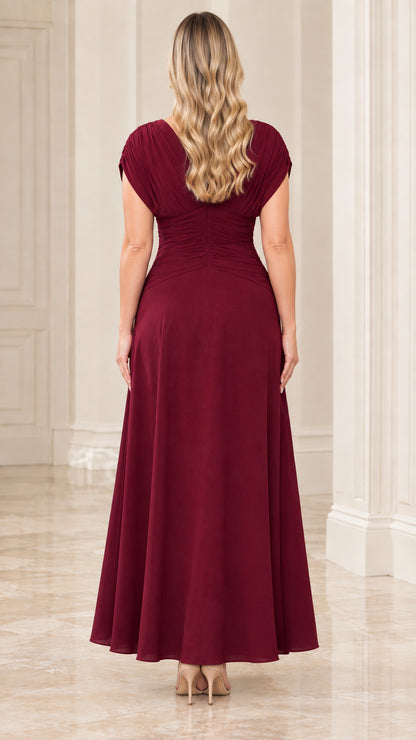 Back view of burgundy cap sleeve pleated evening gown