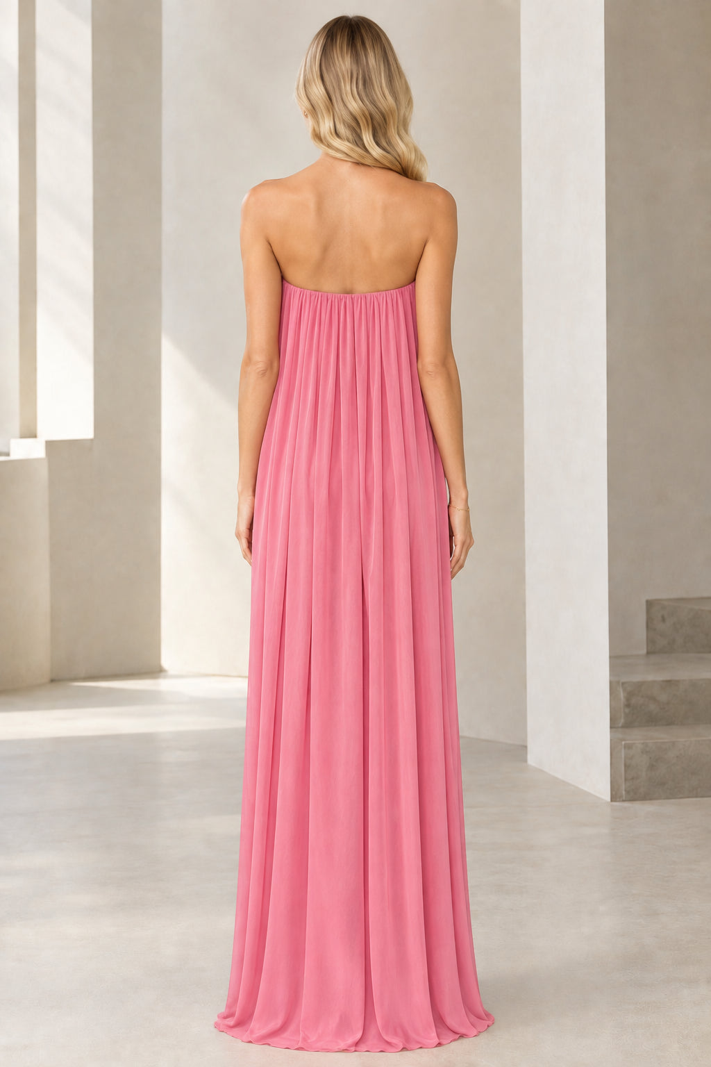 Back view of strapless floor-length evening gown in rose pink