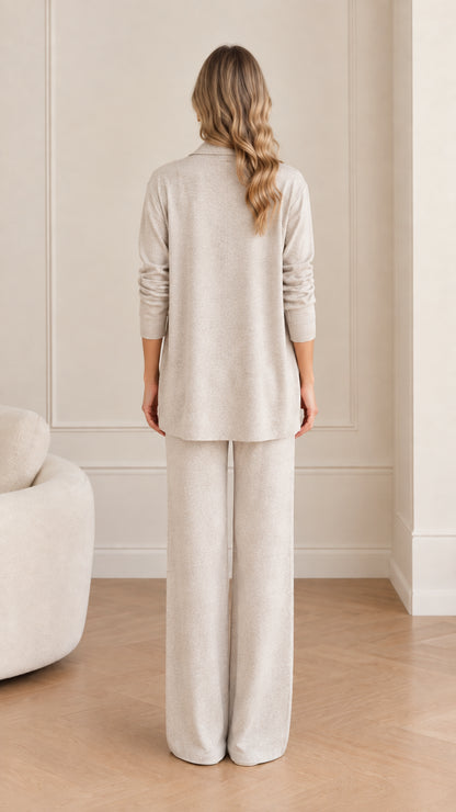 Back view of woman wearing Oatmeal 3-piece knit cardigan and wide-leg pant set