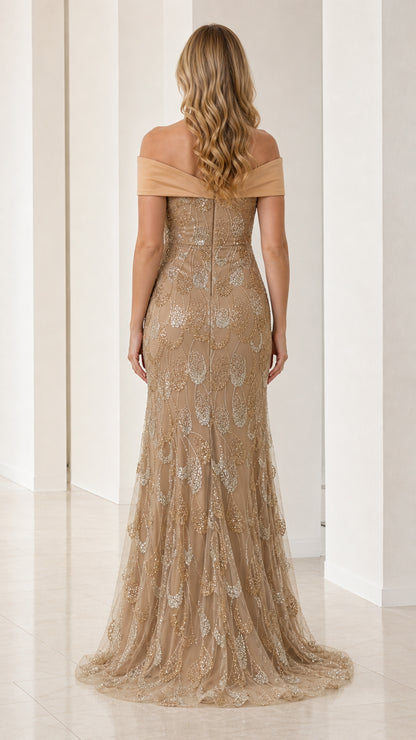 Back view of model in champagne off-the-shoulder mermaid gown with floor-length hem