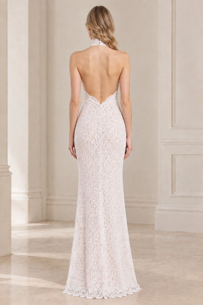 Back view of white halter dress showing open low back design