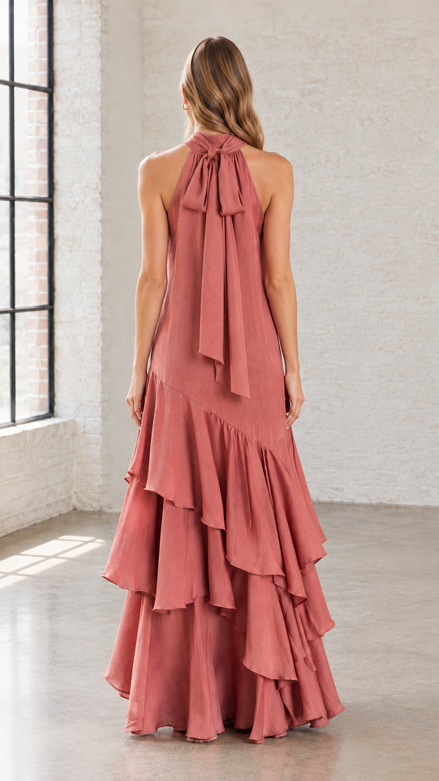 Back view of Dusty Rose halter dress showing the elegant neck bow tie detail