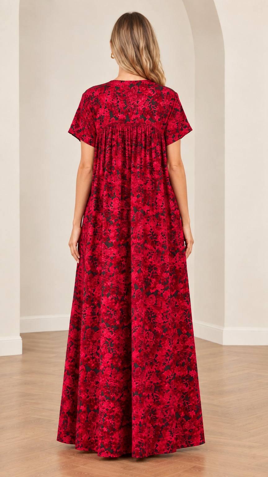 Back view of model in full-length red floral gathered lounger dress