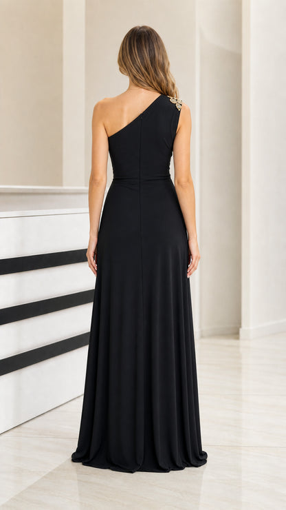 Back view of black one-shoulder floor-length gown