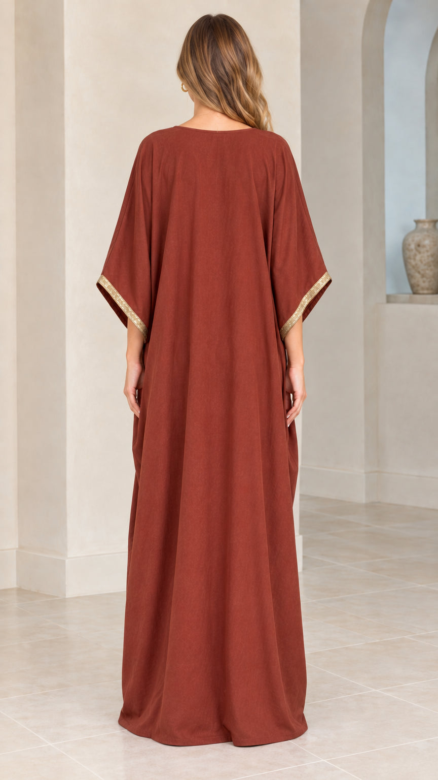 Back view of rust red maxi kaftan dress showing floor-length cut
