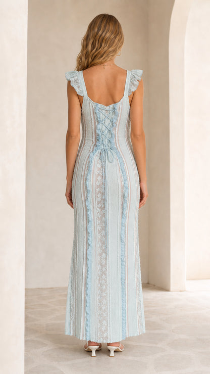Back view showing lace-up details on light blue dress